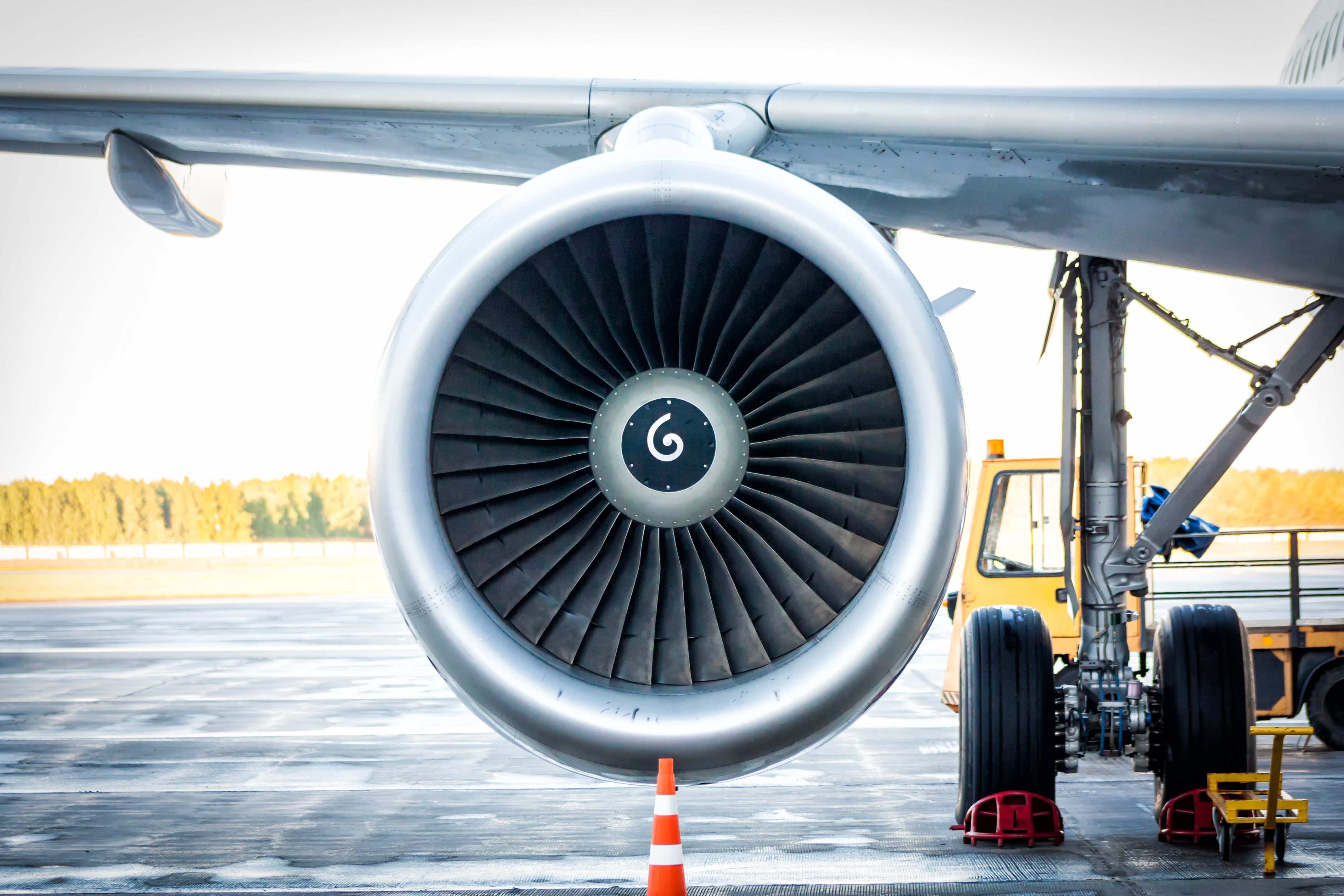 Close-up of engine and main landing gear of passenger airplane