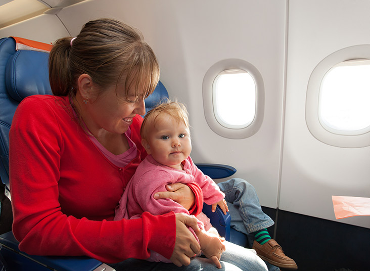 Lady with baby on airplane