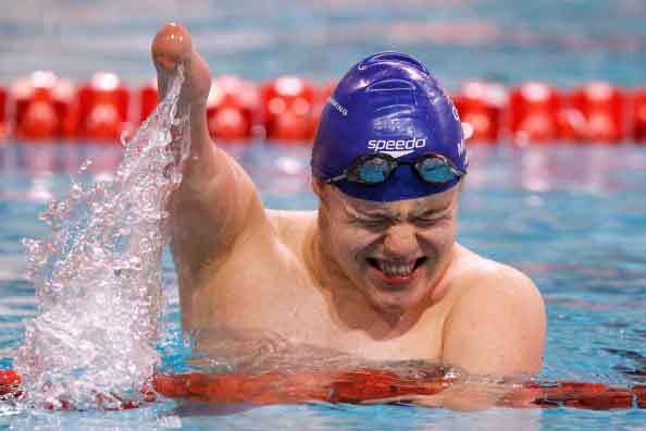 EINDHOVEN, NETHERLANDS - AUGUST 06:  Andrew Mullen of Great Britain celebrates winning the gold medal in the Men's 50m Butterfly S5 Final during the IPC Swimming European Championships held at the Pieter van den Hoogenband Swimming Stadium on August 6, 2014 in Eindhoven, Netherlands.  (Photo by Dean Mouhtaropoulos/Getty Images).jpg