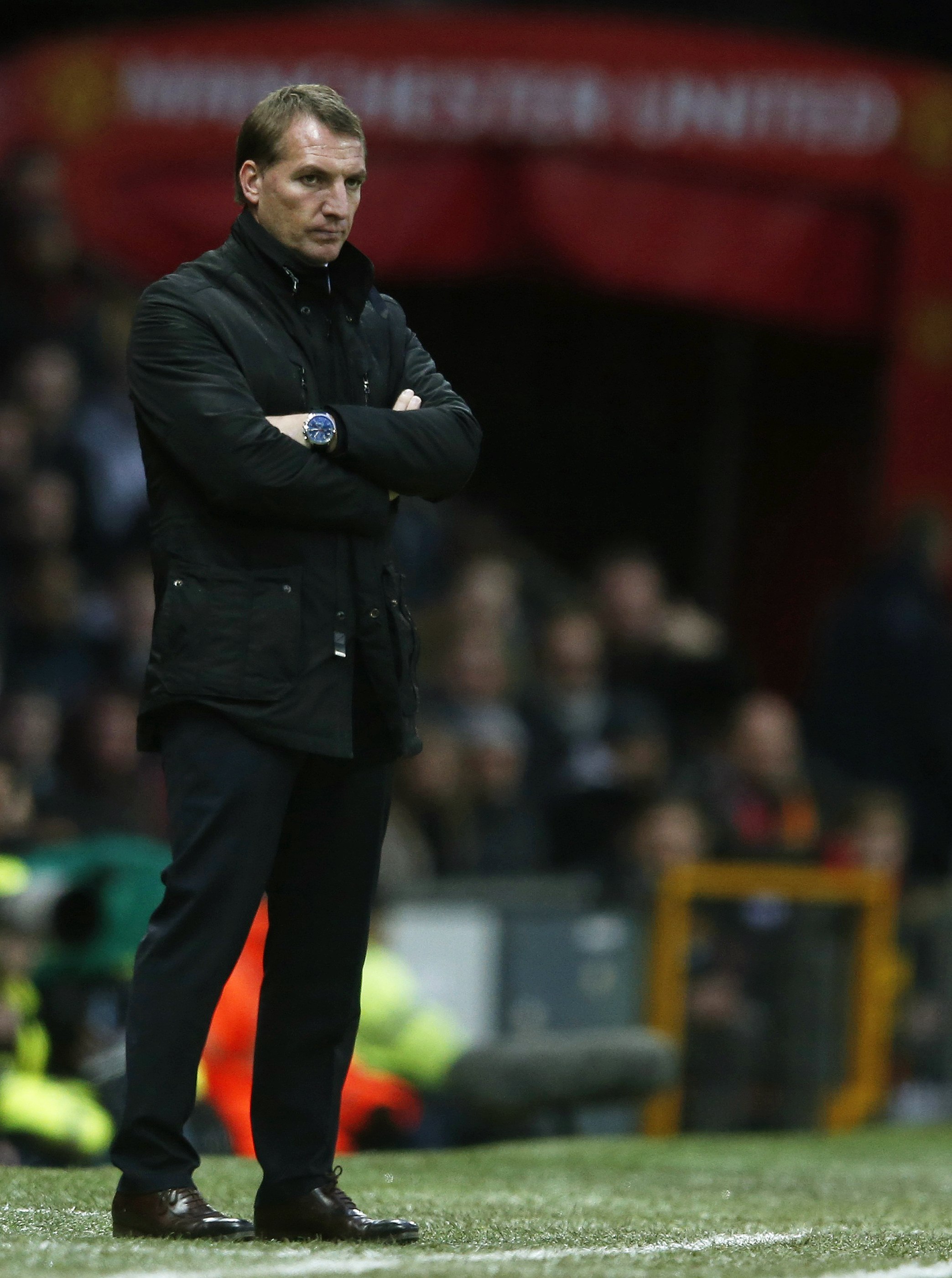 Liverpool manager Brendan Rodgers watches play during their English Premier League soccer match against Manchester United at Old Trafford in Manchester
