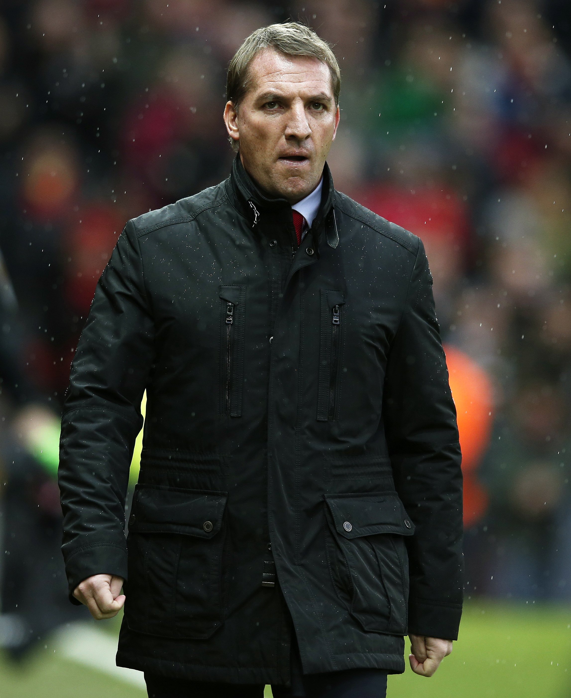Liverpool manager Brendan Rodgers takes his seat before their English Premier League soccer match against Manchester United at Old Trafford in Manchester